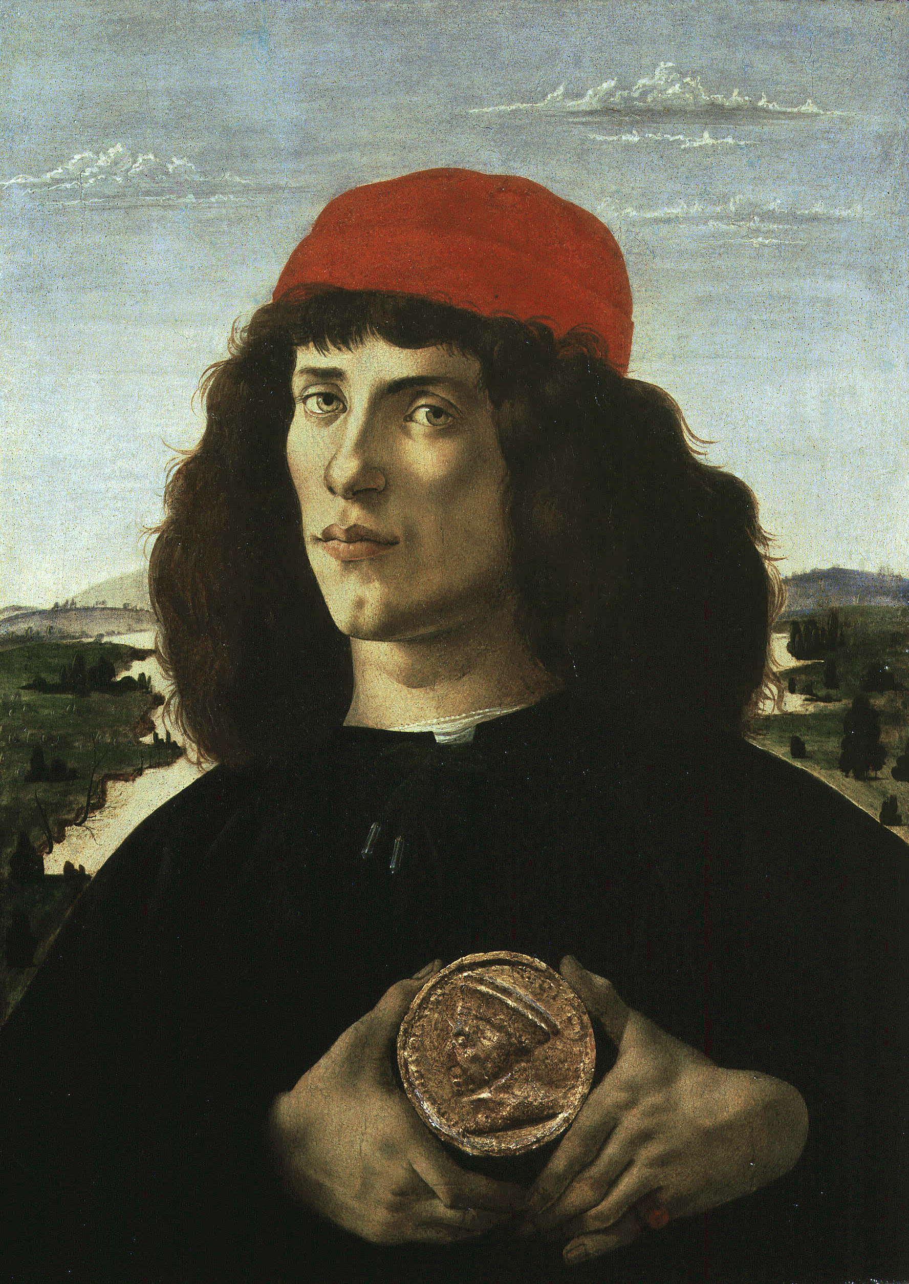 Sandro Botticelli<br /><i>Unknown Man, possibly the artist or his brother, with medal of Cosimo the Elder (1389–1464)</i>, 1474–5<br />Tempera on panel, 57.5 x 44 cm (22 3/5 x 17 3/10 in.)<br />Uffizi, Florence<br />Alfredo Dagli Orti/The Art Archive at Art Resource, NY